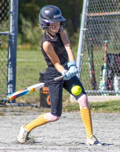 Alivia Wenson swings the bat. s