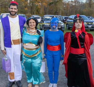 Steve, Melissa, Madison and Viridian dress as characters from Aladdin. f