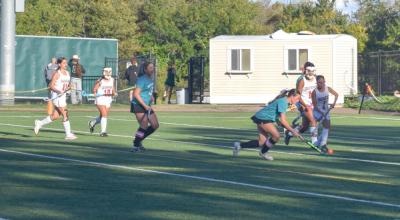 Sydney Almeida keeps the ball away from a Durfee player. 
