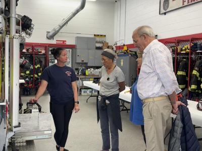 Caroline Abrantes shows off the fire truck equipment to residents.  Caroline Abrantes shows off the fire truck equipment to residents.