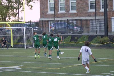 Lucas Macedo, Logan Stott, Luke Fern and Caleb DaSilva block a penalty kick. 