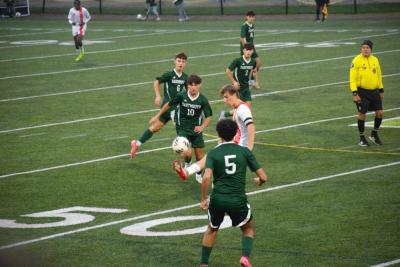 Caleb DaSilva and Caiden DeCosta go for the ball. Photos by Kat Sheridan