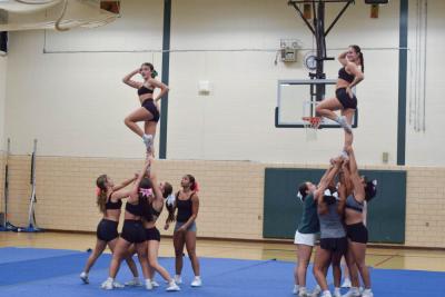 Taylor Beauparland and Cecelia Trahan pose in a stunt. Photos by Kat Sheridan