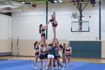 Cecelia Trahan does a leg lift in a stunt. 