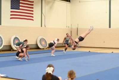 Isabella Cardoso mid-flip. 