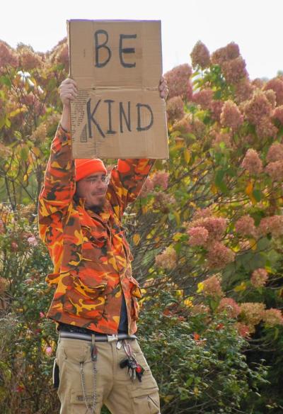 Nathan Bean holds his sign. Photos by Mari Huglin