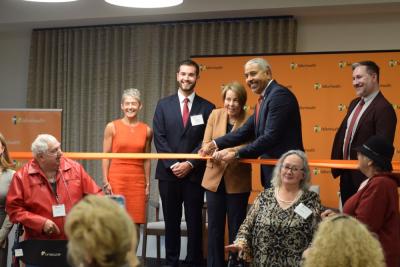 Governor Maura Healey and Manny Lopes cut the ribbon to open the PACE program in Dartmouth. 