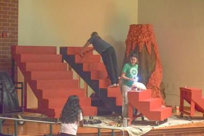 Students decorate the stairs for one of the scenes.