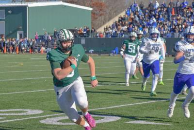 Aiden Gendron runs with the ball to attempt a touchdown. Photos by Kat Sheridan