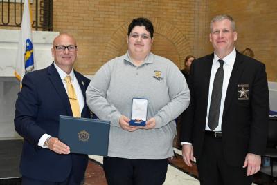 Alyssa Perley with her Employee of the Year award. Source: Bristol County Sheriff's Department