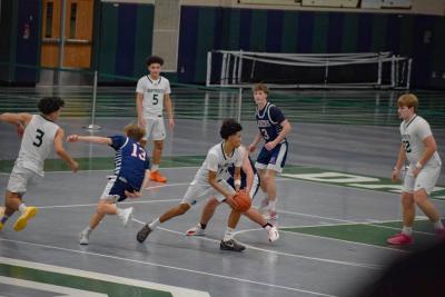 Jace Pina dribbles the ball.