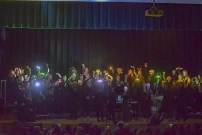 The sixth grade creates a light show for their final song.