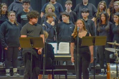 Two students start a song off with solos. 