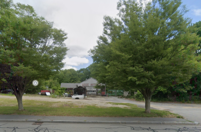 The three-component project would be located at 411 Faunce Corner Road where Rose Motors used to be. Source: Google Maps