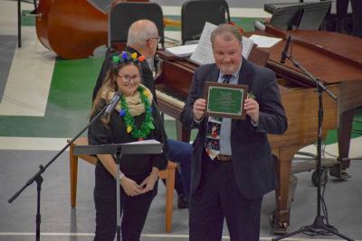 Hudson gives Kiely his plaque. 