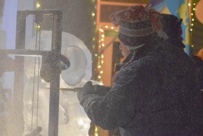 Chip Koser perfects an ice sculpture.