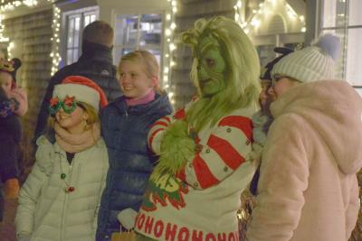 Amelie and Colby Philp pose with the Grinch.