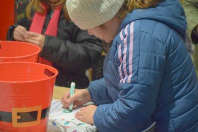 Harper Silva, 9, writes a letter to Santa.
