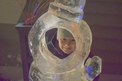 Liam Miller, 7, poses in the ice sculpture.