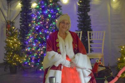 Mrs. Claus shows off her light-up skirt.