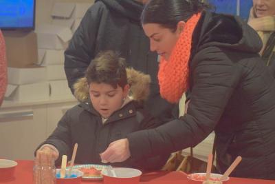 Alexander Couto, 6, decorates a cookie.