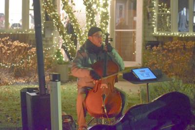 The Punk Cellist plays for those visiting the village. 