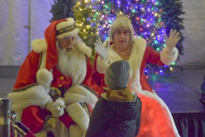 Mr. and Mrs. Santa Claus ask a child what he wants for Christmas.