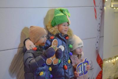 Johnny (4), Eliza (6) and Claira (3) get their photo taken at the selfie spot.