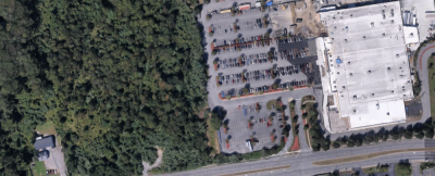 A sky view of the land between the Dartmouth Collision Center (left) and the Walmart (right). Source: Google Earth