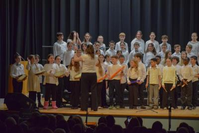 Students perform with boom whackers and hand drums. Photo by Kat Sheridan
