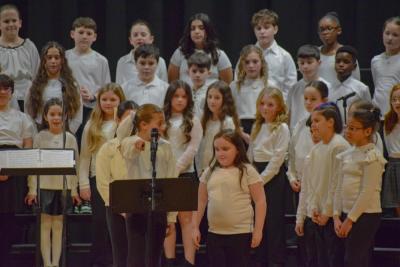 A student from the DeMello School exclaims the audience should  be grateful for the concert. Photo by Kat Sheridan