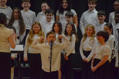 A student from the DeMello School performs a solo. Photo by Kat Sheridan