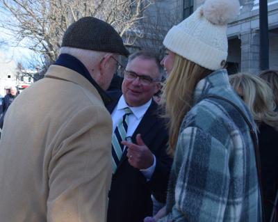 Chris Markey introduces his daughter to a supporter. 