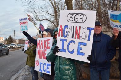 A number of signs protesting I.C.E.