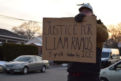 A sign calling for justice for the arrested 5-year-old. 