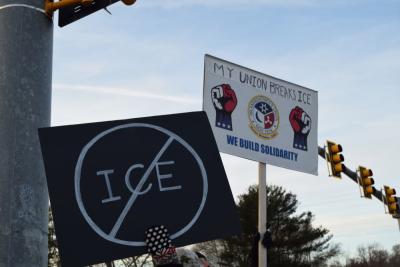 A couple of signs against I.C.E.
