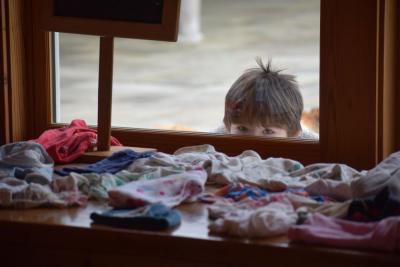 Will Bauer, 5, peeks in at the market.