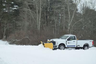 A UMass Dartmouth plow getting rid of the snow.