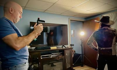 Taking photos of one of the characters. Source: Garry Medeiros