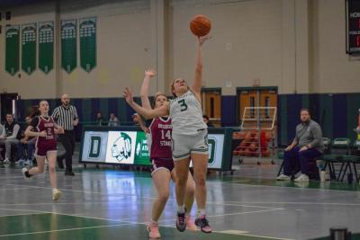 Kaelyn Zuber tries to shoot as Samantha Murphy tries to block her.