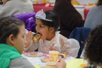 Dani Semedo, age 6, enjoys a cinnamon roll.