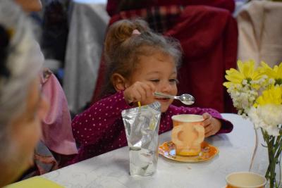 Lilian Grace Mather, age 2, perfects her tea.