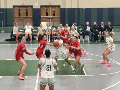 Nia Barnes tosses the ball to Taeya Burgo. 