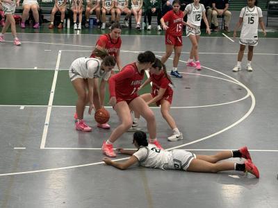 Taeya Burgo tosses the ball to Kyleigh Fredette. 