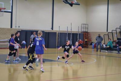Avery Camara tries to grab the ball from Gabby Jonsaint.