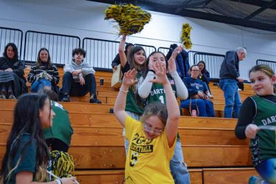Some of the girls celebrate that the team scored. 