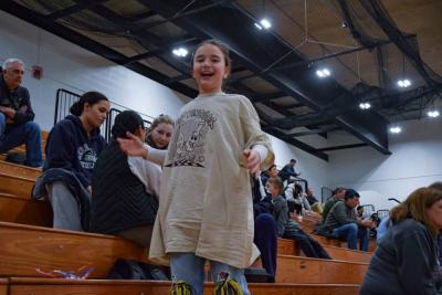 Leah Baptista shows off the shirt she caught.