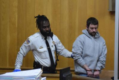 Andrew Johansen being brought into court. Photos by Kat Sheridan