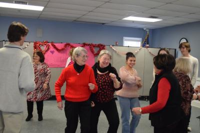 Some members of the council enjoy the dance.