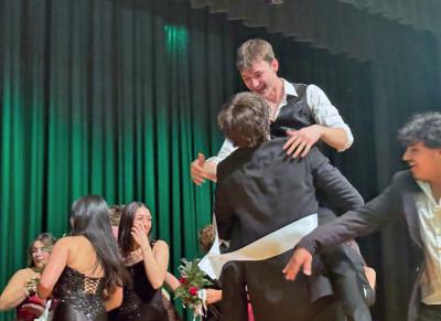 People celebrate that the show went well.